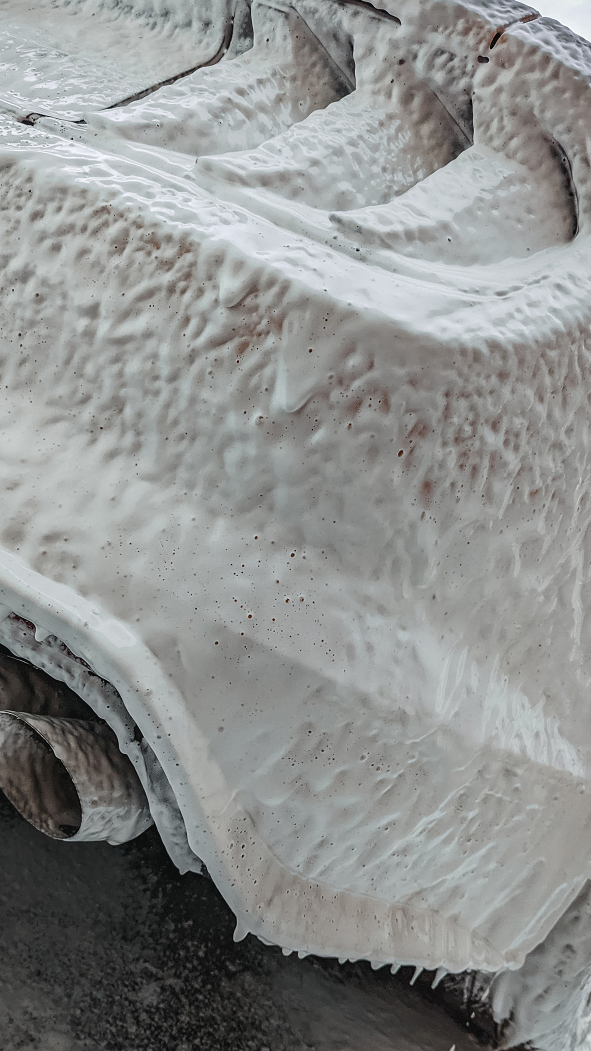 Ford Mustang GT under snow foam