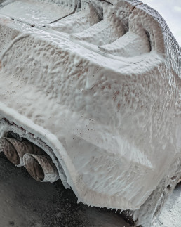 Ford Mustang GT under snow foam